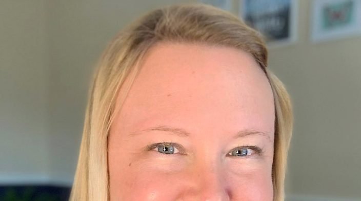 Smiling white woman with blonde hair