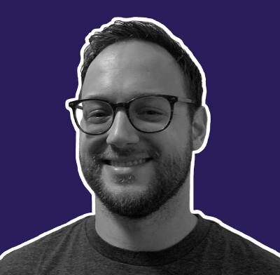 Jake Albion smiling black and white outlined in white with a purple background.