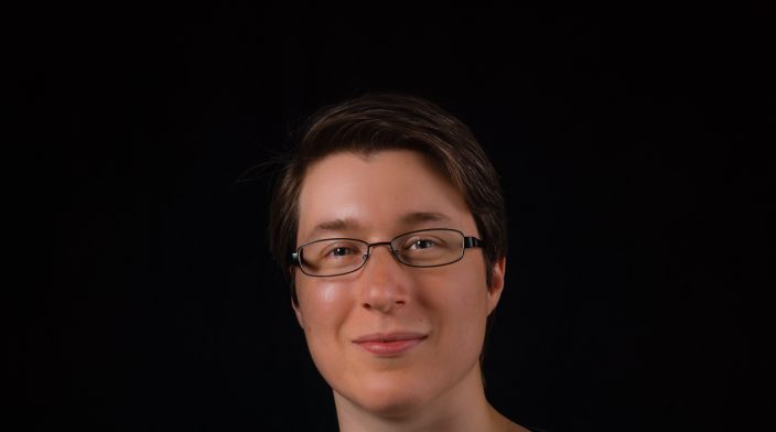 Jeanette is a middle-aged white woman with short hair and glasses.