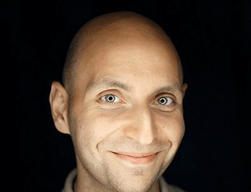 A headshot of Vitaly Friedman, smiling at the camera