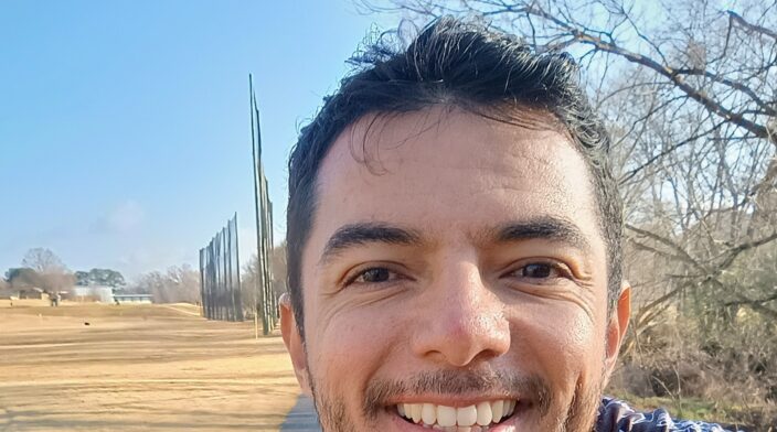 Emilio is a latin american 38 year old man that is smiling and enjoying a bike ride through Charlotte's Irwin Creek Greenway