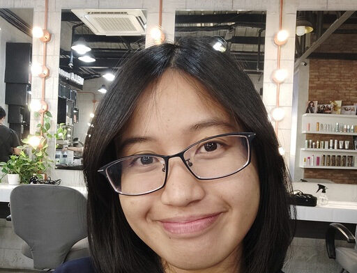 Toni Garcia is a Filipina woman with shoulder-length dark hair and glasses. She is smiling at the camera with a warm, friendly expression.