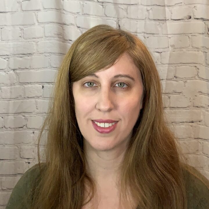 Gen Herres is a white woman in her 40’s with long brown hair and a big friendly smile