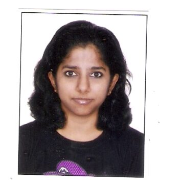 Reshma Iqbal is a brown woman in her 40s with shoulder-length black hair and a slight smile.